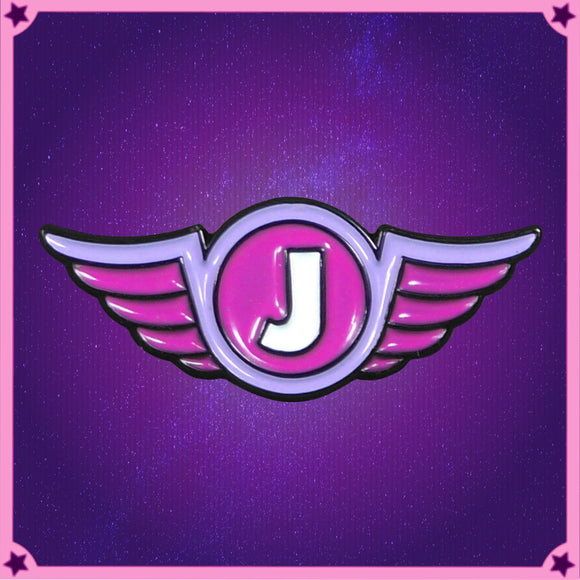 A textured enamel pin with raised black metal outline around recessed enamel, making a four colour version of the Jimquisition logo, a white J on a pink circle, ringed by purple, with pink wings.